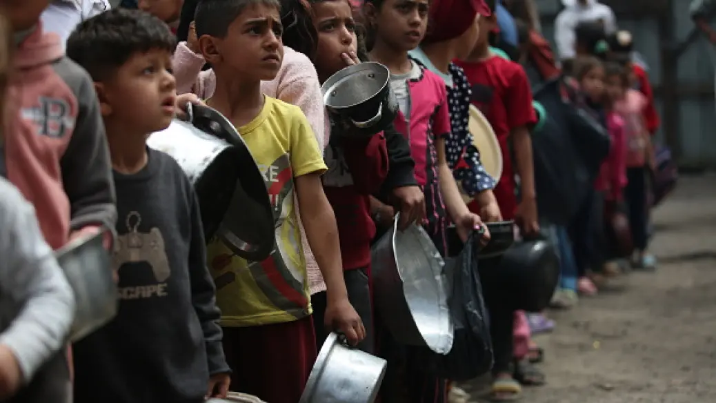 Hungry children awaiting emergency food aid