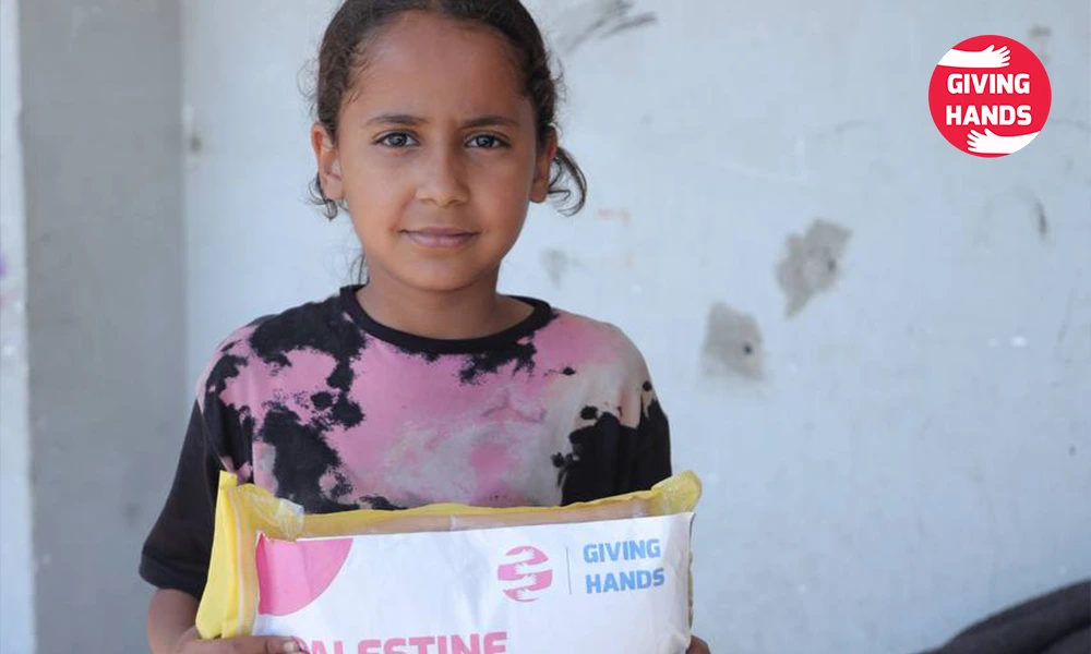 Helping Orphans: The Islamic Case for Showing Up 2 Palestine orphan receiving humanitarian aid package